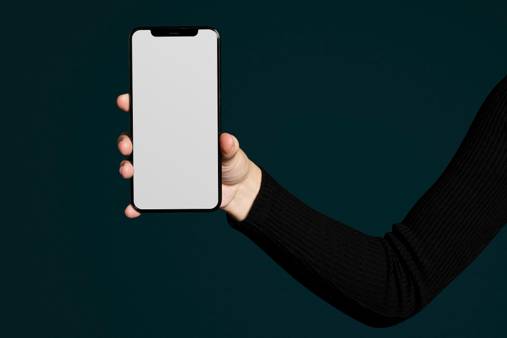 Person holding oversized smartphone uncomfortably